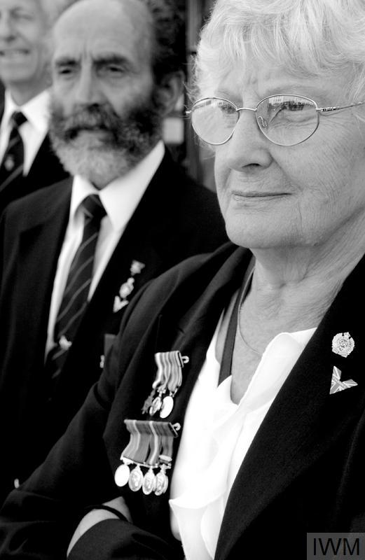The widow of a Second World War serviceman wears his medals at the Victory and Freedom Parade organised in Newbury, Berkshire to commemorate the 60th anniversary of the end of the Second World War. Similar events took place throughout Britain. © Crown Copyright. IWM (HU 94254) 